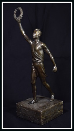 Berlin. Bronze statue of athlete holding laurel cr