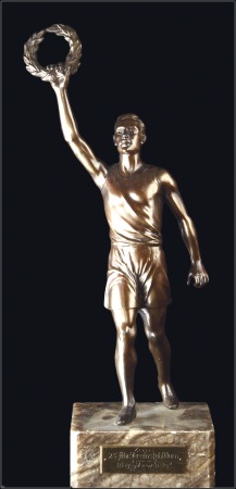 Statues: Athlete in bronze holding up an Olympic winner's wreath