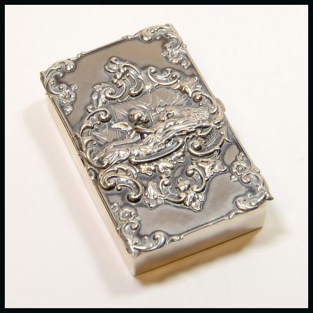 American Silver Boxes: Sterling silver stamp box with double compartment, lid in relief depicting a cherub holding a lady